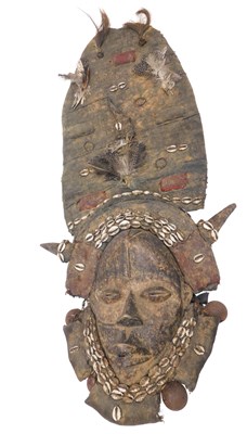 Lot 213 - A Dan tribal mask, Ivory Coast, 40cm high.