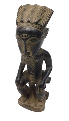 Lot 217 - A Baule tribal figure, Ivory Coast, 29cm high.
