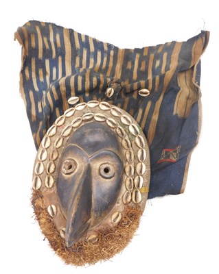 Lot 235 - A Dan Maou tribal mask, Ivory Coast, 24cm high.