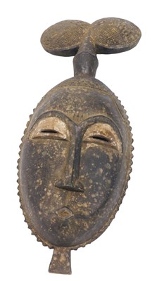Lot 236 - A Baule tribal mask, Ivory Coast, 43cm high.