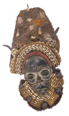 Lot 239 - A Dan tribal mask, Ivory Coast, 42cm high.
