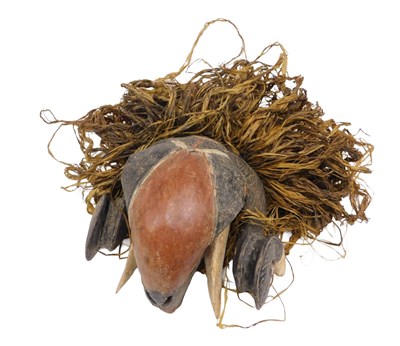 Lot 241 - A Baule ram tribal mask, Ivory Coast, 27cm high.