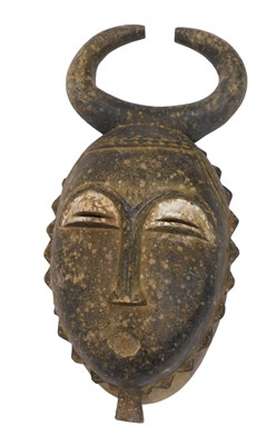 Lot 254 - A Baule tribal mask, Ivory Coast, 41cm high.