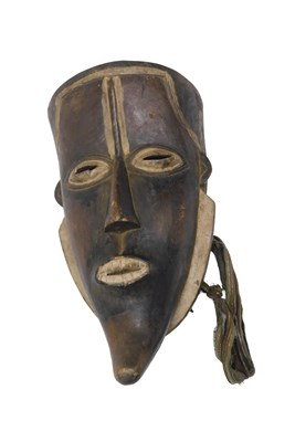 Lot 257 - A Bete tribal mask, Ivory Coast, 42cm high.