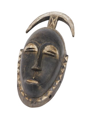 Lot 260 - A Baule tribal mask, Ivory Coast, 42cm high.