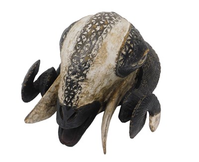 Lot 262 - A Baule tribal ram mask, Ivory Coast, 34cm high.