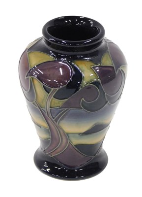 Lot 24 - A Moorcroft Western Isles vase, on a dark blue...