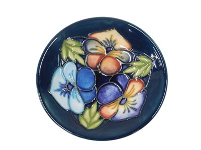 Lot 25 - A Moorcroft Triple Choice pin dish, on a dark...