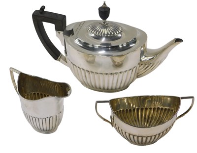 Lot 5 - A Edwardian silver three piece tea set,...