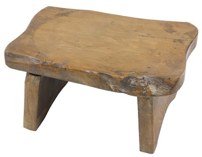 Lot 148 - A small rustic elm stool, with metal plaque...