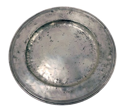 Lot 194 - An 18thC large pewter charger, initialled LM,...