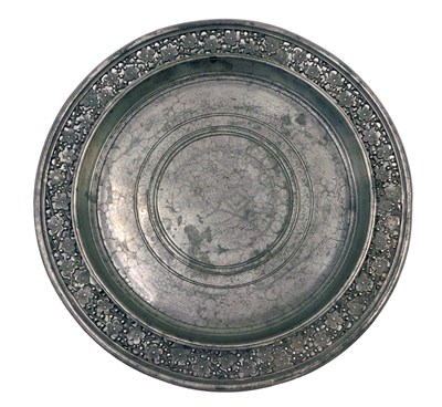 Lot 195 - A 19thC Oriental pewter plaque or dish, with...