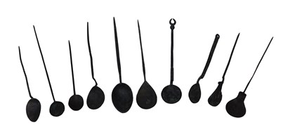 Lot 286 - A collection of Roman and other bronze spoons,...