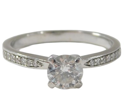 Lot 58 - A diamond and platinum ring, with single stone,...