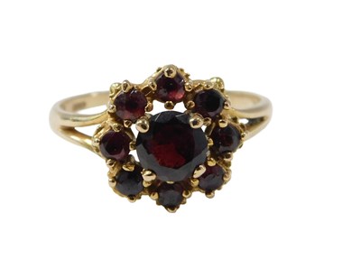 Lot 78 - A 9ct gold garnet cluster ring, with V splayed...