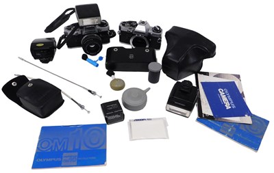 Lot 317 - An Olympus OM10 camera, cased, with flash, an...