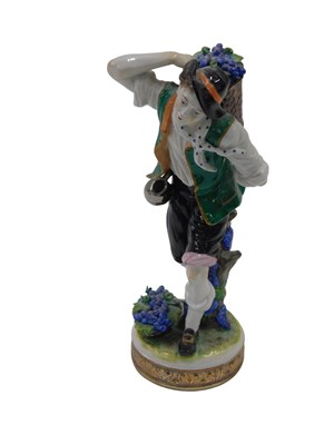 Lot 358 - A 20thC Volkstedet porcelain figure of a grape...