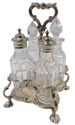 Lot 391 - A William IV silver four bottle cruet stand,...