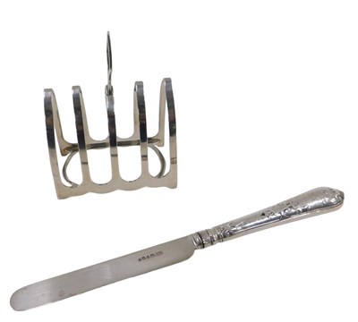 Lot 392 - An Edward VII silver four division toast rack,...