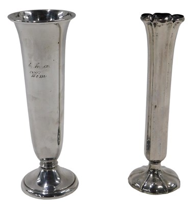 Lot 397 - Two loaded white metal bud vases, possibly...