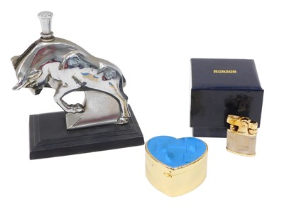 Lot 434 - A Ronson charging bull table lighter, boxed,...