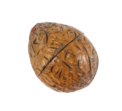 Lot 475 - A carved wooden walnut shaped thimble case,...