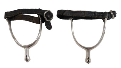 Lot 481 - A pair of silvered metal spurs, with leather...