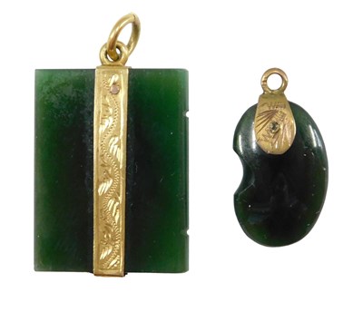 Lot 495 - Two jade pendants, comprising a rectangular...