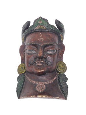 Lot 506 - A Tibetan carved wooden tribal wall mask,...
