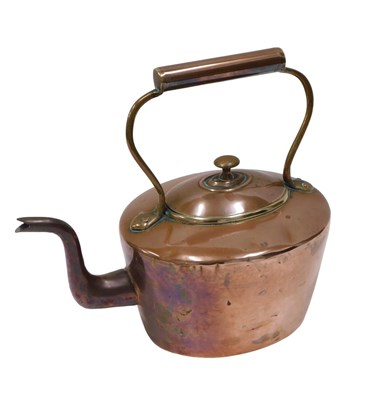 Lot 513 - A Victorian copper and brass kettle, 33cm wide.