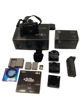 Lot 555 - An Olympus OM-D camera, boxed, an Olympus OM-D-...