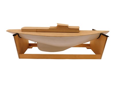 Lot 557 - A partially made model boat on stand, 79cm long.