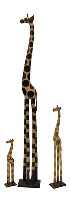 Lot 561 - A large carved wooden giraffe, 203cm high, and...