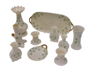 Lot 604 - A collection Belleek Shamrock pattern items,...