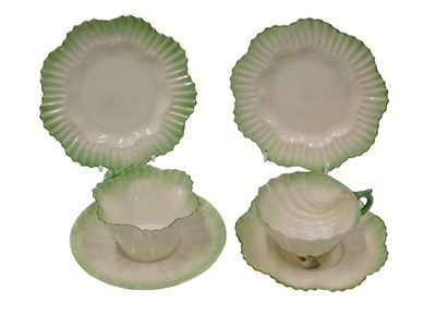 Lot 616 - A Belleek porcelain cup and saucer, decorated...