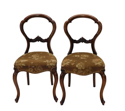 Lot 668 - A pair of Victorian walnut balloon back chairs,...