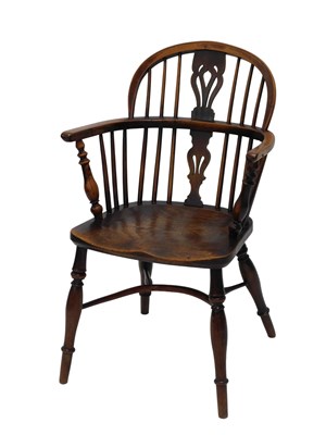 Lot 669 - A 19thC yew and elm Windsor armchair, with...