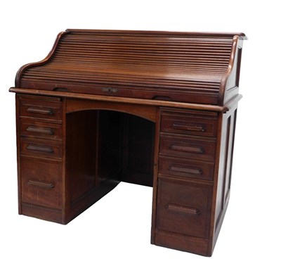 Lot 694 - An early 20thC walnut roll top desk, the...