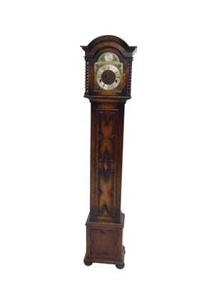 Lot 702 - A 1920s grandmother clock, the brass and...