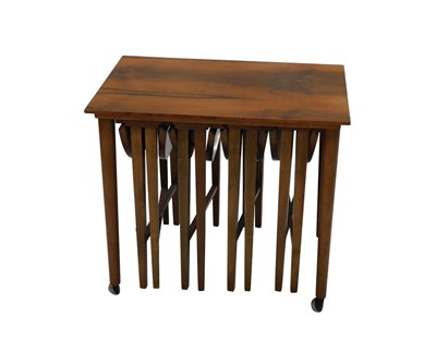 Lot 646 - A teak nest of tables, the largest with a...