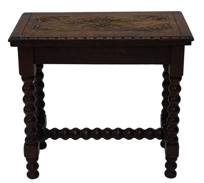 Lot 647 - A 19thC carved oak fold over card table, the...