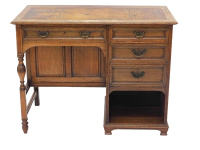 Lot 651 - An early 20thC Garnett and Sons oak desk, the...