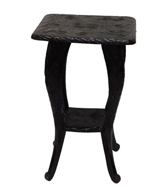 Lot 660 - An early 20thC Liberty style carved wooden two...