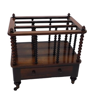 Lot 664 - A Victorian rosewood Canterbury, the top with...