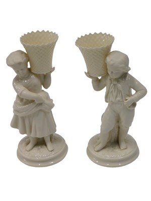 Lot 587 - A pair of Belleek porcelain basket bearer...