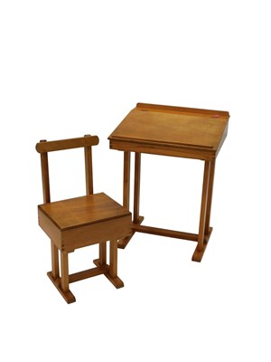 Lot 675 - A beech and plywood child's desk and matching...