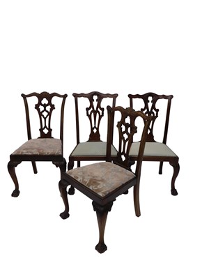 Lot 677 - A set of four George III style mahogany dining...