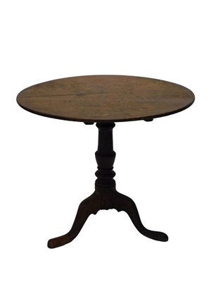 Lot 686 - A 19thC oak tilt top occasional table, on a...