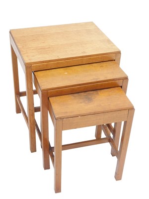 Lot 705 - A nest of three oak tables, each with a...