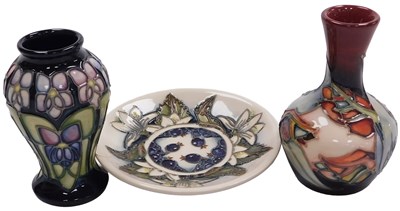 Lot 111 - A Moorcroft pottery Violet pattern vase,...